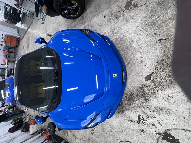 Ferrari in a blue colour-change wrap