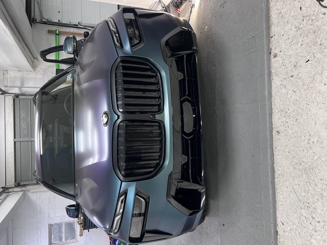 BMW X7 in deep green with chrome delete